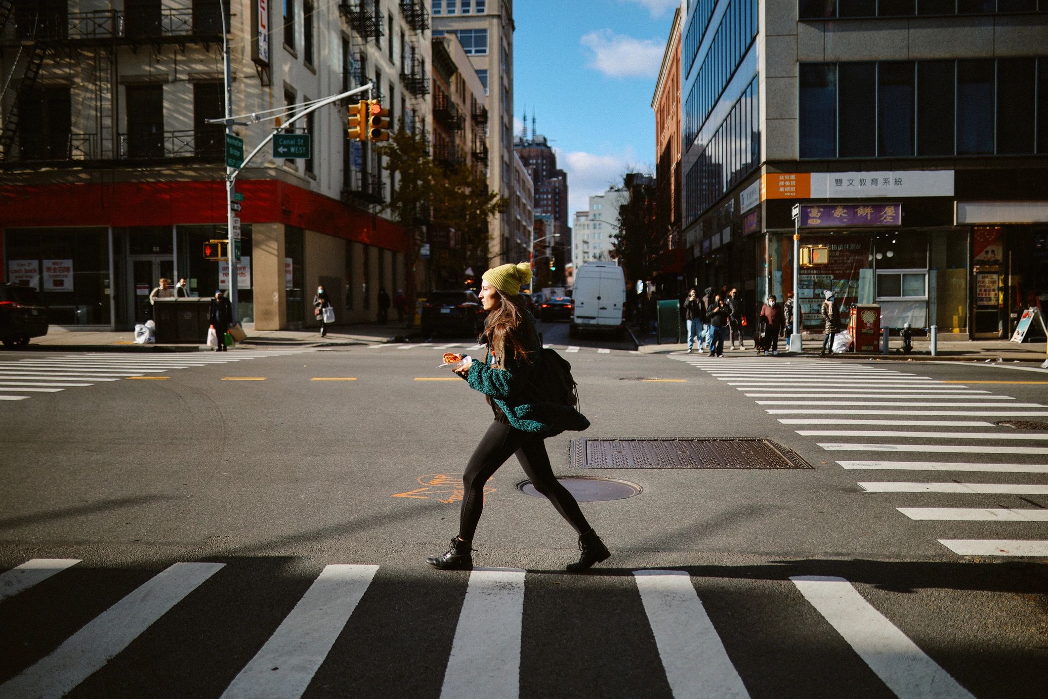 Commuter eating pizza on the go in a city