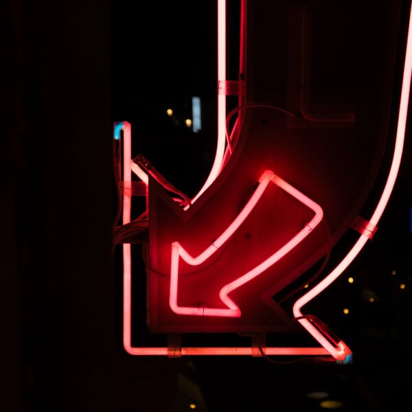 Minimal neon sign glow on a dark background, desert-night vibe placeholder.